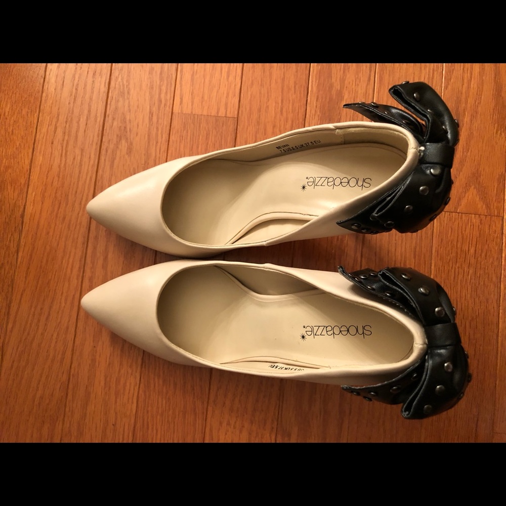 Tan stiletto heels with black faux leather studded bows on back - slightly worn